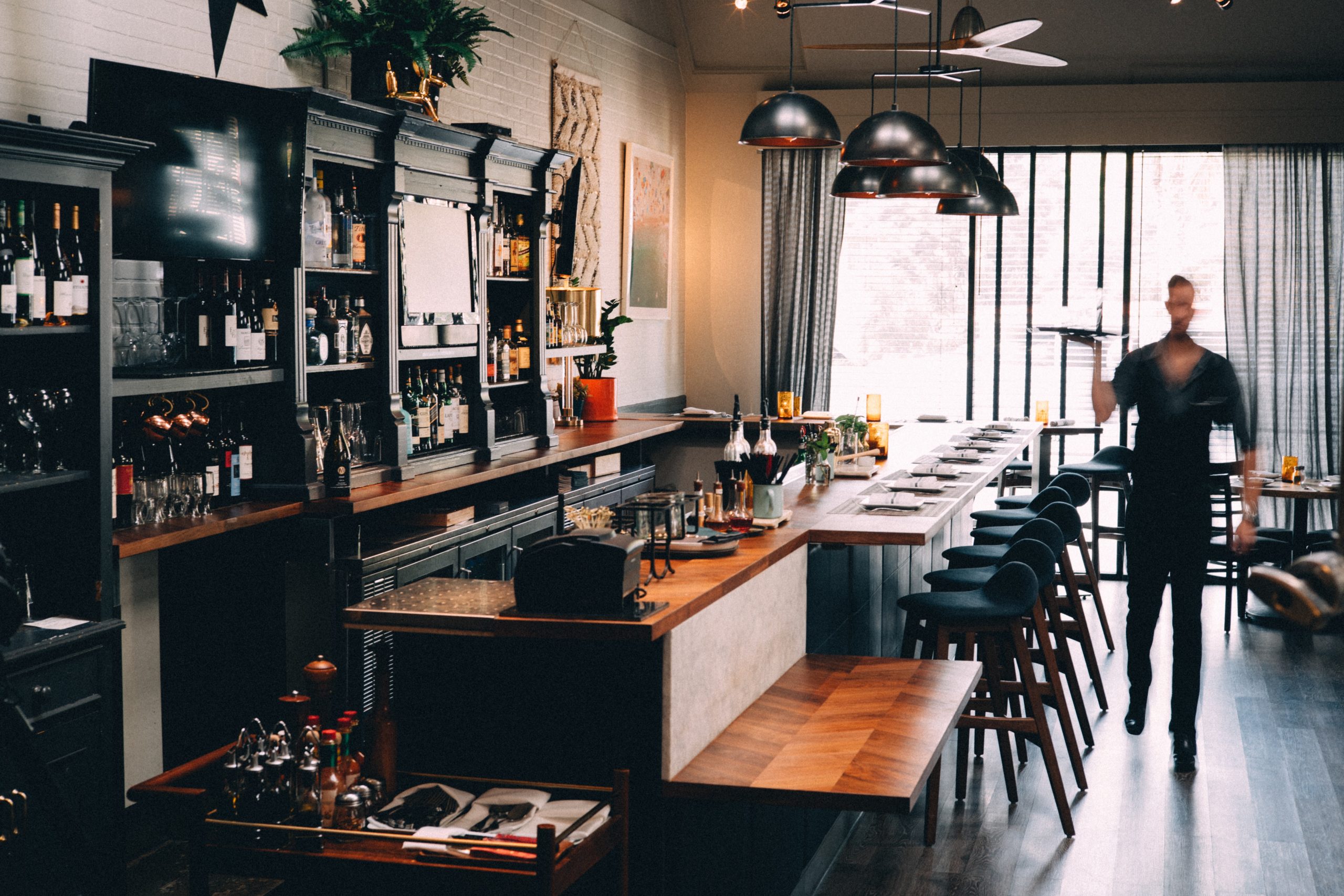 view of the bar and waiter